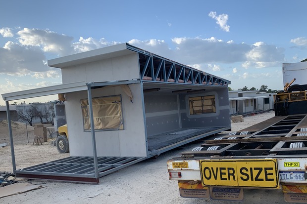 Oversized prefabricated modular unit in transit for on-site assembly, showcasing Rapid Modular WA's scalable and customizable modular solutions for large industrial and commercial projects across Western Australia.