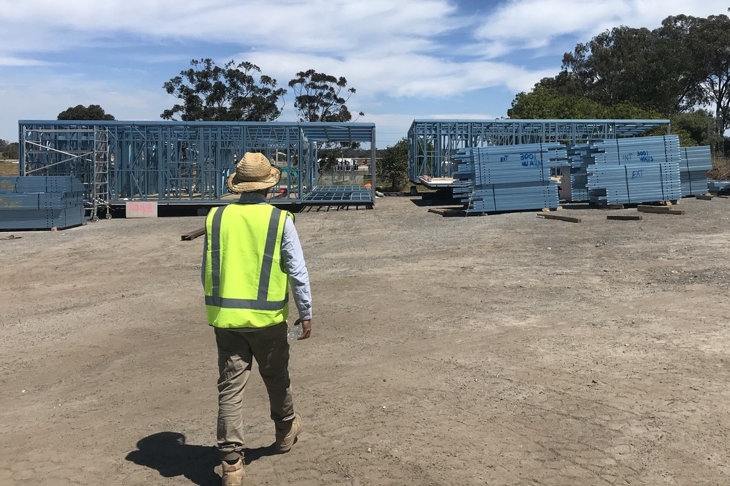 Justin Wilson, CEO of Rapid Modular WA, inspecting steel modular frames at a construction site, highlighting innovative modular building solutions for large-scale commercial and residential developments in Australia.