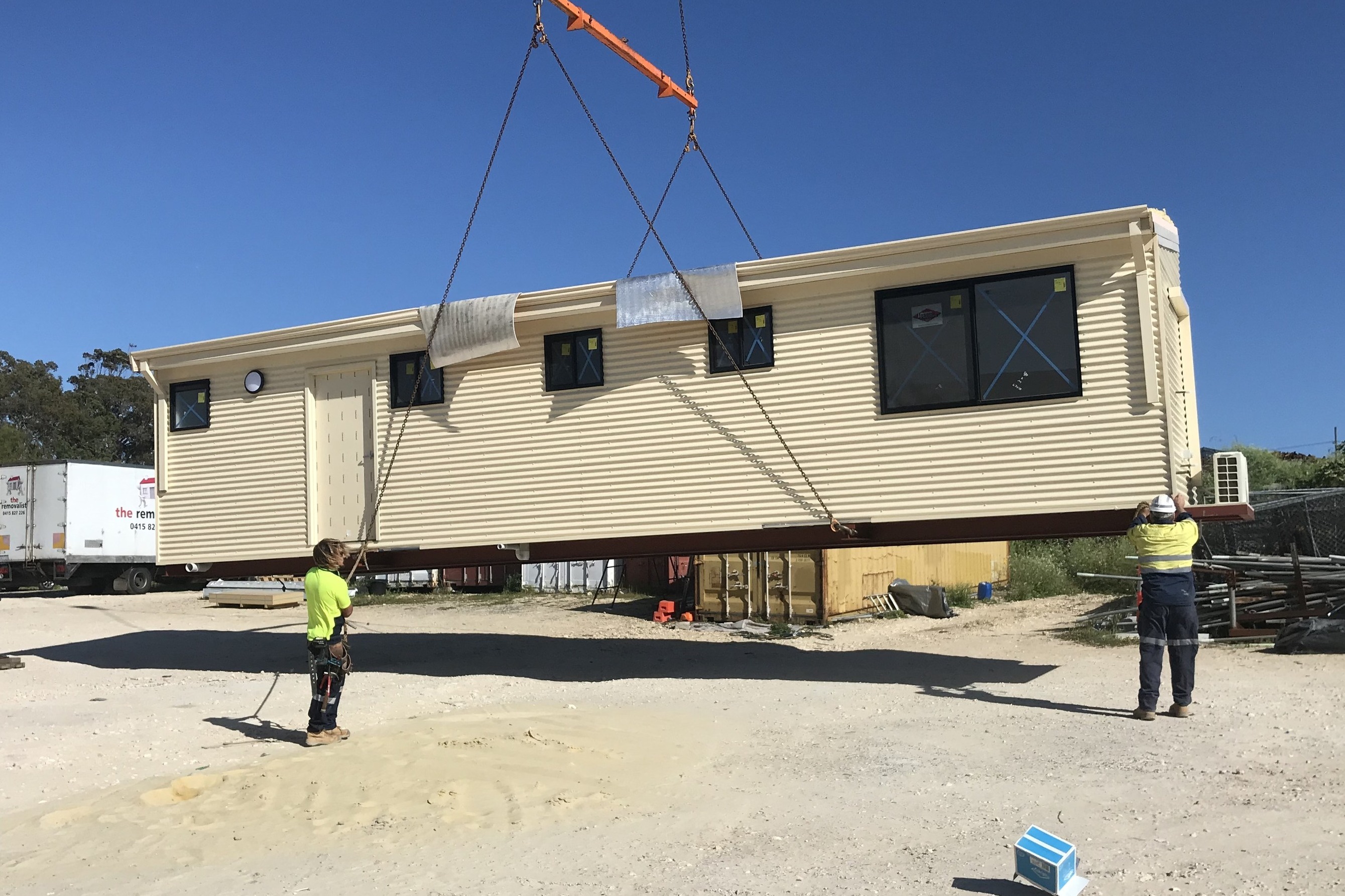 Modular housing unit being precisely lifted by crane for seamless installation, showcasing Rapid Modular WA's efficient construction methods in Perth and surrounding regions.