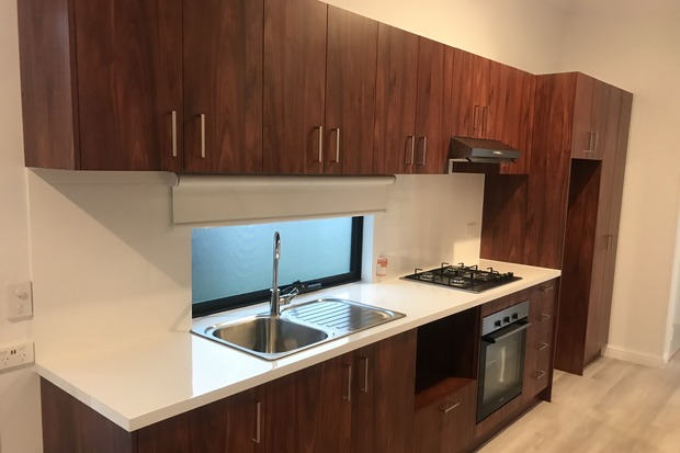 Contemporary modular kitchen with sleek wood finishes, built by Rapid Modular WA, offering sustainable, stylish interiors for homes and offices in Perth.